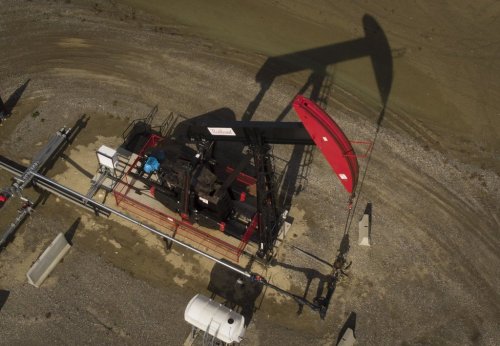 A pumpjack draws out oil and gas from a well head near Cremona, Alta., Tuesday, July 15, 2025. THE CANADIAN PRESS/Jeff McIntosh