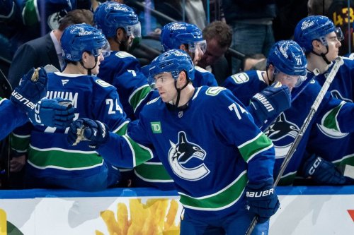 Vancouver Canucks' Jake DeBrusk (74) celebrates his goal against the Seattle Kraken with his teammates during the second period of an NHL game in Vancouver, on Friday, Jan. 2, 2026. THE CANADIAN PRESS/Ethan Cairns