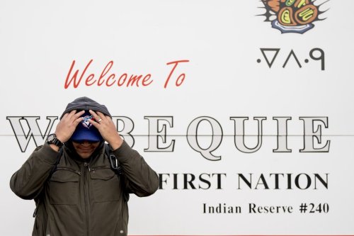A person waits at the airstrip in Webequie, Ont., on Thursday, Oct. 23, 2025. THE CANADIAN PRESS/Christopher Katsarov