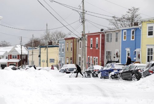 Residents of St. John's, N.L., are shown shovelling out on Monday Jan. 5, 2026, after the first storm of the new year dumped about 20 centimetres of snow on Newfoundland and Labrador's capital city. THE CANADIAN PRESS/Sarah Smellie