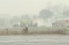 This screengrab made from video provided by WSOC shows firefighting crews responding to a reported plane crash at a regional airport in Statesville, N.C., erupting in a large fire, Thursday, Dec. 8, 2025. (WSOC via AP)