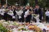 New South Wales Premier Chris Minns, right, and Kellie Sloane, leader of the opposition, the New South Wales Liberal Party, lay wreaths at a tribute for shooting victims outside the Bondi Pavilion at Sydney's Bondi Beach, Monday, Dec. 15, 2025, a day after a shooting. (AP Photo/Mark Baker)