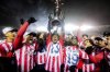Atletico Ottawa's Ballou Tabla (13) raises the North Star Cup following Atletico Ottawa’s victory over Cavalry FC in extra time during the Canadian Premier League finals soccer action in Ottawa, on Sunday, Nov. 9, 2025. THE CANADIAN PRESS/Spencer Colby