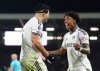 Fulham's Raul Jimenez, left, celebrates scoring their side's first goal of the game during the Premier League match between NottinghamForest and Fulham, in London, Monday Dec. 22, 2025. (Adam Davy/PA via AP)
