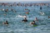 FILE - Surfers and swimmers head out to the ocean as a tribute following Sunday's shooting at Bondi Beach, in Sydney, Friday, Dec. 19, 2025. (AP Photo/Steve Markham,File)