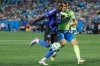 CF Montreal forward Prince Owusu, left, moves the ball against Charlotte FC midfielder Andrew Privett during the first half of an MLS soccer match in Charlotte, N.C., Saturday, Sept. 27, 2025. (AP Photo/Nell Redmond)