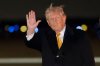 President Donald Trump waves as he arrives on Air Force One, Sunday, Jan. 4, 2026, at Joint Base Andrews, Md. (AP Photo/Alex Brandon)
