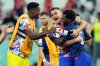 FILE - United States' Yunus Musah, right, Aaron Long, center, and United States' goalkeeper Sean Johnson celebrate after defeating Iran in the World Cup group B soccer match between Iran and the United States at the Al Thumama Stadium in Doha, Qatar, Tuesday, Nov. 29, 2022. (AP Photo/Ashley Landis, File)