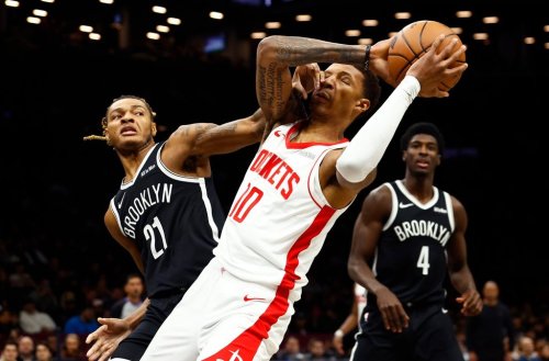 Brooklyn Nets forward Noah Clowney (21) defends against Houston Rockets forward Jabari Smith Jr. (10) during the first half of an NBA basketball game, Thursday, Jan. 1, 2026, in New York. (AP Photo/Noah K. Murray)