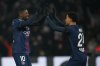 PSG's Ousmane Dembele, left, and Senny Mayulu celebrate after a goal during the French Ligue 1 soccer match between Paris Saint-Germain and Paris FC in Paris, Sunday, Jan. 4, 2026. (AP Photo/Christophe Ena)