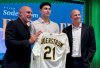 Tyler Soderstrom, center, holds up his jersey during a news conference joined by manager Mark Kotsay, left, and General Manager David Forst at the A's Ballpark Experience Center in Las Vegas, Nev. on Tuesday, Dec. 30, 2025. (AP Photo/Mark Anderson)