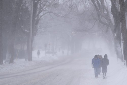 Pedestrians make their way down Bell Road in Halifax on Sunday, Feb. 4, 2024. THE CANADIAN PRESS/Darren Calabrese