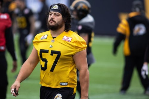 Hamilton Tiger-Cats Brandon Revenberg takes part in a practice at Tim Hortons Field during the CFL's Grey Cup week in Hamilton on Friday, December 10, 2021. Revenberg has been a model of durability with the Tiger-Cats. THE CANADIAN PRESS/Nick Iwanyshyn