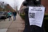 A poster seeking information about the campus shooting suspect is seen on the campus of Brown University, Wednesday, Dec. 17, 2025, in Providence, R.I. (AP Photo/Robert F. Bukaty)