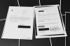 Pages that show New York grand jury subpoenas being issued into the Jeffrey Epstein and Ghislaine Maxwell investigation, then pages of redactions that follow, in this document released by the U.S. Justice Department, are photographed, Friday, Dec. 19, 2025, in Washington. (AP Photo/Jon Elswick)