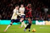 Everton's James Garner, left, and Bournemouth's Antoine Semenyo battle for the ball during the English Premier League soccer match between Bournemouth and Everton in Bournemouth, England, Tuesday, Dec. 2, 2025. (Andrew Matthews/PA via AP)