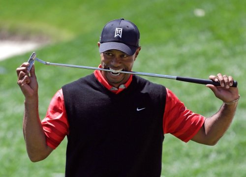 FILE - Tiger Woods bites down on his club after missing a putt for par on the 18th green during the final round of the Arnold Palmer Invitational golf tournament, March 25, 2013, in Orlando, Fla. (AP Photo/John Raoux, File)