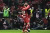 Toluca's Jesus Angulo, left, and Alexis Vega celebrate their side's second goal scored by Paulinho against Tigres during the Mexican soccer league second leg final match in Toluca, Mexico, Sunday, Dec. 14, 2025. (AP Photo/Eduardo Verdugo)