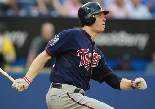 Minnesota Twins first baseman Justin Morneau watches his solo home run sail over the right-field fence against the Blue Jays in Toronto on Tuesday, July 6, 2010. THE CANADIAN PRESS/Darren Calabrese
