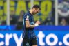 Inter Milan's Hakan Calhanoglu leaves the pitch after an injury during a Champions League, league phase, soccer match between Inter Milan and Liverpool in Milan, Italy, Tuesday, Dec.9, 2025. (AP Photo/Luca Bruno)