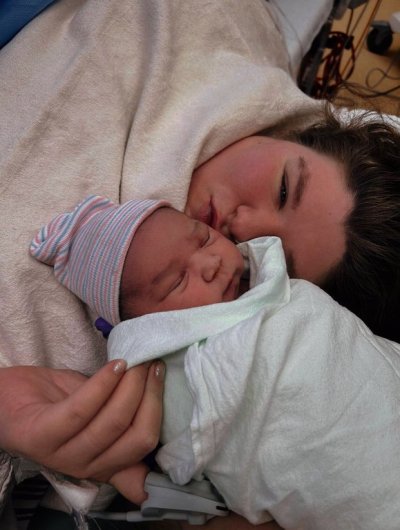 Alyson Brown-Tremblay poses with her daughter, Lessy-Ann, in a January 1, 2026, handout photo. Lessy-Ann was born two minutes after midnight at the CHU de Québec-Université Laval in Quebec City, Que. THE CANADIAN PRESS/Handout — CHU de Quebec-Universite Laval (Mandatory Credit)