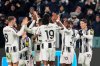 Juventus's Mattia Perin celebrates with teammates after scoring their side's second goal of the game during the Italian Serie A soccer match between Juventus and Cagliari in Torino, Italy, Saturday, Nov. 29, 2025. (Fabio Ferrari/LaPresse via AP)