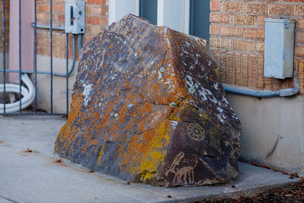 Church repatriates sacred rock covered with petroglyphs after 14-year ...
