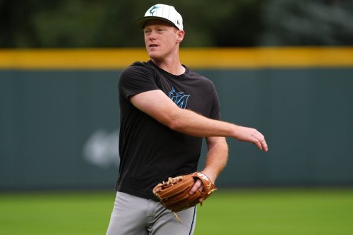FILE - Miami Marlins first baseman Eric Wagaman (33) warms up before a baseball game Wednesday, Sept. 17, 2025, in Denver. (AP Photo/David Zalubowski, File)