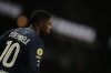 PSG's Ousmane Dembele waits to kick a corner during the French League One soccer match between Paris and Rennes in Paris, France, Saturday, Dec. 6, 2025. (AP Photo/Thibault Camus)