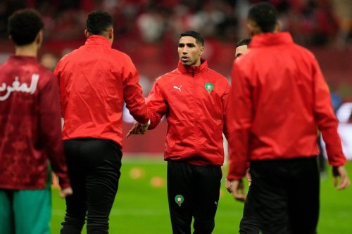 Morocco's Achraf Hakimi shakes hands with teammates ahead of the African Cup of Nations Group A soccer match between Morocco and Mali in Rabat, Morocco, Friday, 26, 2025. (AP Photo/Mosa'ab Elshamy)