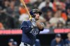 FILE - Tampa Bay Rays Brandon Lowe follows through on a solo home run against the Baltimore Orioles in the third inning of a baseball game, Wednesday, Sept. 24, 2025, in Baltimore. (AP Photo/Gail Burton, File)