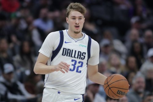 Dallas Mavericks forward Cooper Flagg dribbles the ball up court during the first half of an NBA basketball game against the Sacramento Kings, Tuesday, Jan. 6, 2026, in Sacramento, Calif. (AP Photo/Scott Marshall)