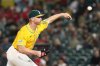 FILE - Athletics pitcher Sean Newcomb throws against the Cincinnati Reds during the ninth inning of a baseball game Friday, Sept. 12, 2025, in West Sacramento, Calif. (AP Photo/Sara Nevis, File)