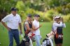 Steve Stricker, left, and his daughter Izzi Strickler, second from right, wait to hit from the third fairway as his daughter Bobbi Strickler, second from left, and his wife Nicki Strickler work as their caddies during the final round of the PNC Championship golf tournament, Sunday, Dec. 21, 2025, in Orlando, Fla. (AP Photo/Phelan M. Ebenhack)