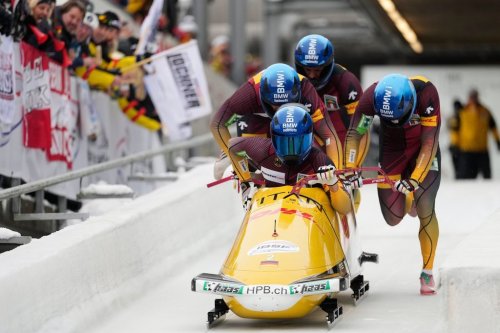 Johannes Lochner, Thorsten Margis, Joern Wenzel and Georg Fleischhauer, of Germany, compete in the 4-man bobsleigh race at the Bobsleigh World Cup in Innsbruck, Austria, Sunday, Nov. 30, 2025. (AP Photo/Matthias Schrader)