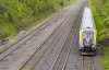 A VIA Rail train is seen on tracks in Dorval, Que., as it heads out of Montreal on Friday, May 23, 2025. THE CANADIAN PRESS/Christinne Muschi