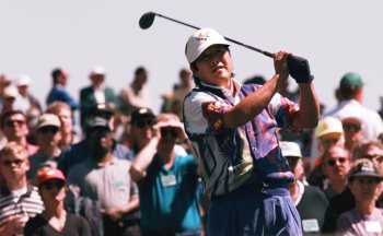 FILE - Japan's Jumbo Ozaki watches his tee shot on the third hole during his opening round of the Masters at the Augusta National Golf Club in Augusta, Ga., April 10, 1997. (AP Photo/Bill Waugh, File)