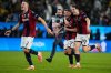 Bologna's Ciro Immobile, center, celebrates with teammates Emil Holm, left, and Giovanni Fabbian after scoring the winning goal during a penalty shoot out at the end of an Italian Super Cup semi-final soccer match between Bologna and Inter Milan in Riyadh, Saudi Arabia, Friday, Dec. 19, 2025. (AP Photo/Altaf Qadri)