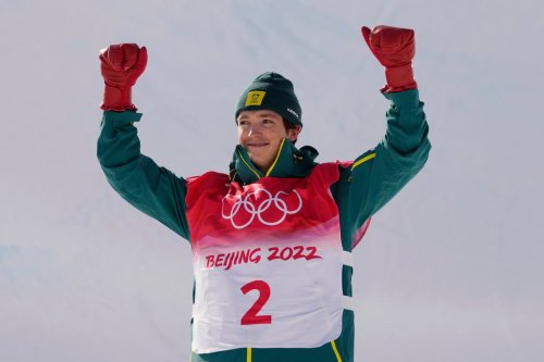 FILE - Silver medal winner Australia's Scotty James celebrates during the venue award ceremony for the men's halfpipe finals at the 2022 Winter Olympics, Friday, Feb. 11, 2022, in Zhangjiakou, China. (AP Photo/Francisco Seco, File)