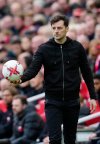 FILE - Tottenham's interim head coach Ryan Mason, centre holds the ball during an English Premier League soccer match between Liverpool and Tottenham Hotspur at Anfield stadium in Liverpool, Sunday, April 30, 2023. (AP Photo/Jon Super, File)