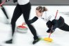 FILE - Rachel Homan, right, throws a rock during Canadian Olympic curling trials action against Team Brown in Halifax, Nova Scotia, Canada, Tuesday, Nov. 25, 2025. (Darren Calabrese/The Canadian Press via AP, File)
