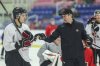Tij Iginla, left, talks with Kyle Turris at Canada's training camp ahead of the world junior hockey championship Niagara Falls, Ont., on Tuesday, Dec. 16, 2025. THE CANADIAN PRESS/Nick Iwanyshyn