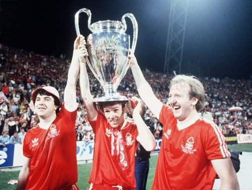 FILE - Nottingham Forest's John Robertson, left, Ian Bowyer, center, and Kenny Burns, right, carry the European Cup in triumph after their 1-0 win against Malmo FF in Munich, Germany, May 30, 1979. (AP Photo, File)