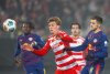 Berlin's Aljoscha Kemlein, left, fights for the ball with Leipzig's Kevin Kampl during the Bundesliga soccer match between FC Union Berlin and RB Leipzig, in Berlin, Germany, Friday, Dec. 12, 2025. (Soeren Stache/dpa via AP)