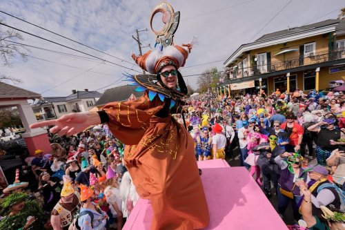 FILE- People gather for the start of the Society of Saint Anne's parade on Mardi Gras Day, March 4, 2025 in New Orleans. (AP Photo/Gerald Herbert, File)