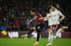 Arsenal's Declan Rice, right, challenges Bournemouth's Justin Kluivert during the English Premier League soccer match between Bournemouth and Arsenal in Bournemouth, England, Saturday, Jan. 3, 2026. (AP Photo/Alastair Grant)