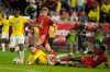 Colombia's Rafael Borre Santos, second from left, goes to the ground with Canada's Richie Laryea, right, while Canada's Luc de Fougerolles (15) and Colombia's Andres Felipe Roman (24) look on during the second half of a friendly international soccer match against Canada in Harrison, N.J., Tuesday, Oct. 14, 2025. (AP Photo/Seth Wenig)