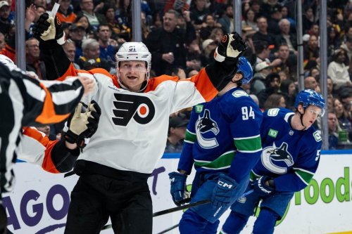 Philadelphia Flyers' Carl Grundstrom (91) celebrates his goal as Vancouver Canucks' Linus Karlsson (94) and Tom Willander (5) skate off during second period NHL action in Vancouver, on Tuesday, December 30, 2025. THE CANADIAN PRESS/Ethan Cairns
