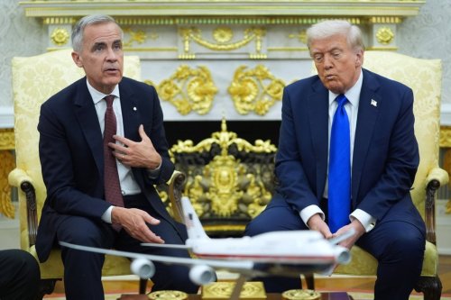 U.S. President Donald Trump and Prime Minister Mark Carney meet in the Oval Office of the White House, Tuesday, Oct. 7, 2025, in Washington. (AP Photo/Evan Vucci)