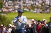 Rory McIlroy, of Northern Ireland, reacts after putting on the fourth hole during the fourth round of the Australian Open golf tournament in Melbourne, Australia, Sunday, Dec. 7, 2025. (AP Photo/Asanka Brendon Ratnayake)